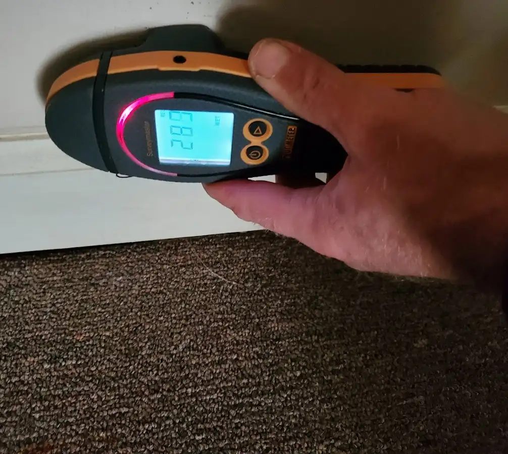 Moisture detection at baseboard during Storm Damage Restoration in South Bay